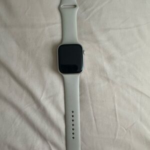 Apple Smartwatch in Starlight with matching band.
